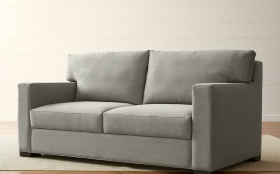 Image of the Crate and Barrel Axis II Queen Sleeper Sofa, a stylish and comfortable sofa that easily converts into a queen-sized bed.