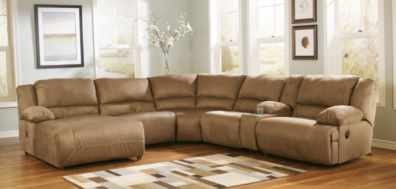 Image of Ashley Furniture Signature Design Hogan Oversized Reclining Sectional Sofa with plush cushions and reclining seats
