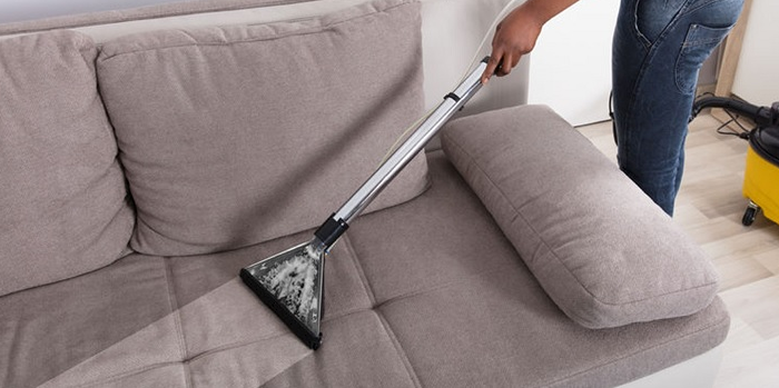 Image showing the best way to clean a sofa with a vacuum cleaner and upholstery cleaner