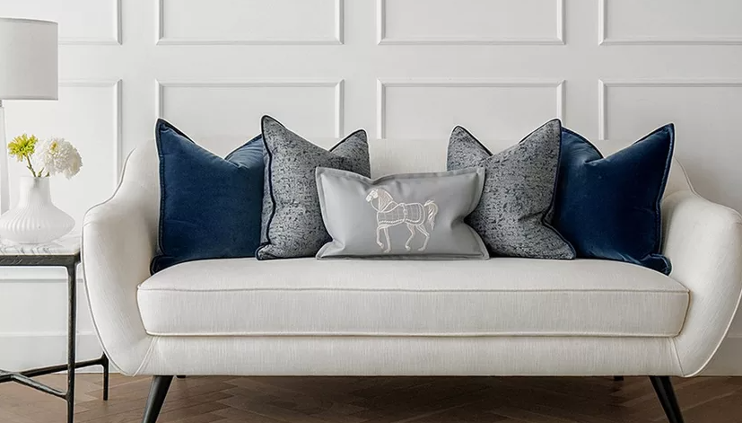Down-filled cushions in various colors and patterns